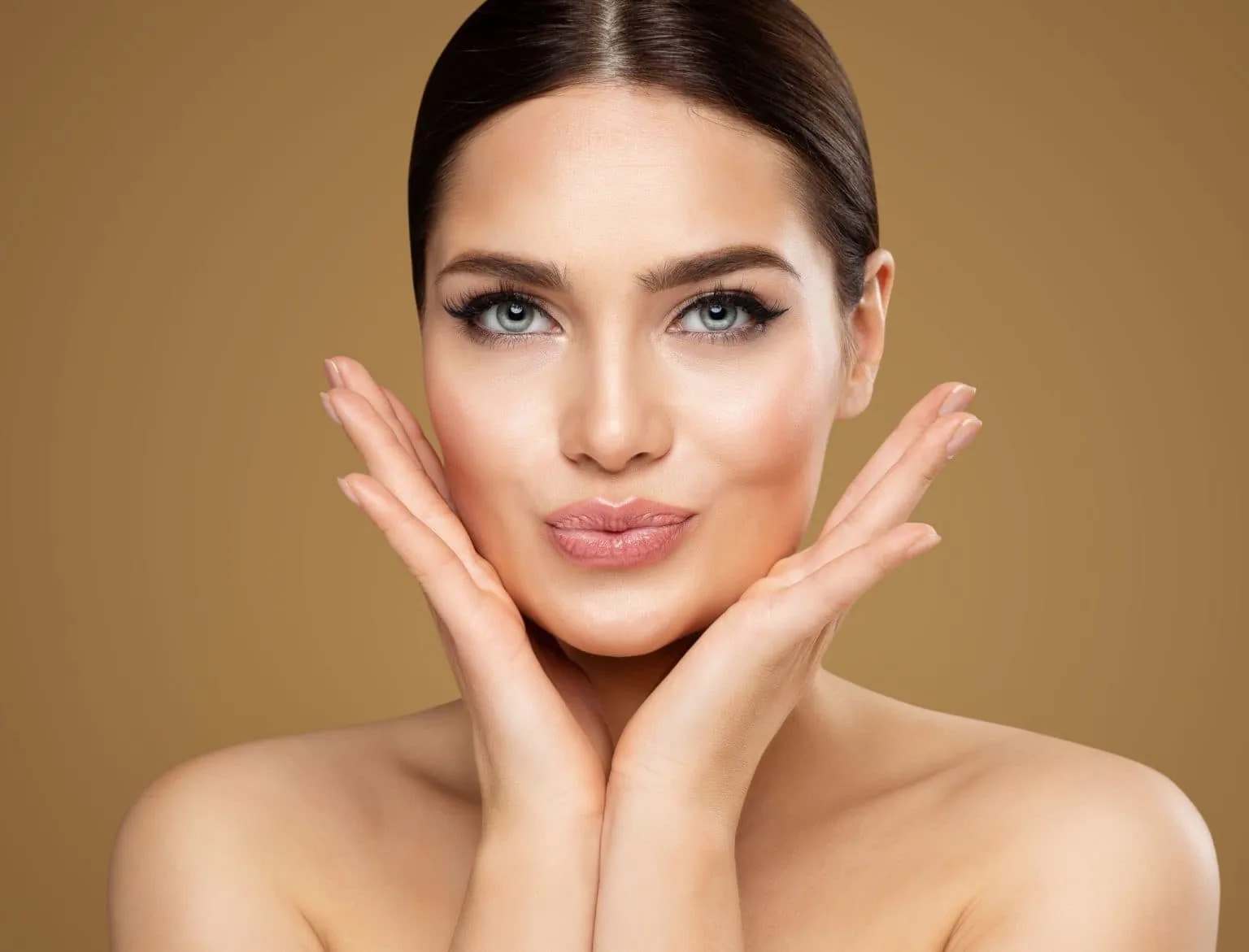 A woman is having a face beauty consultation in Auburn, MA.