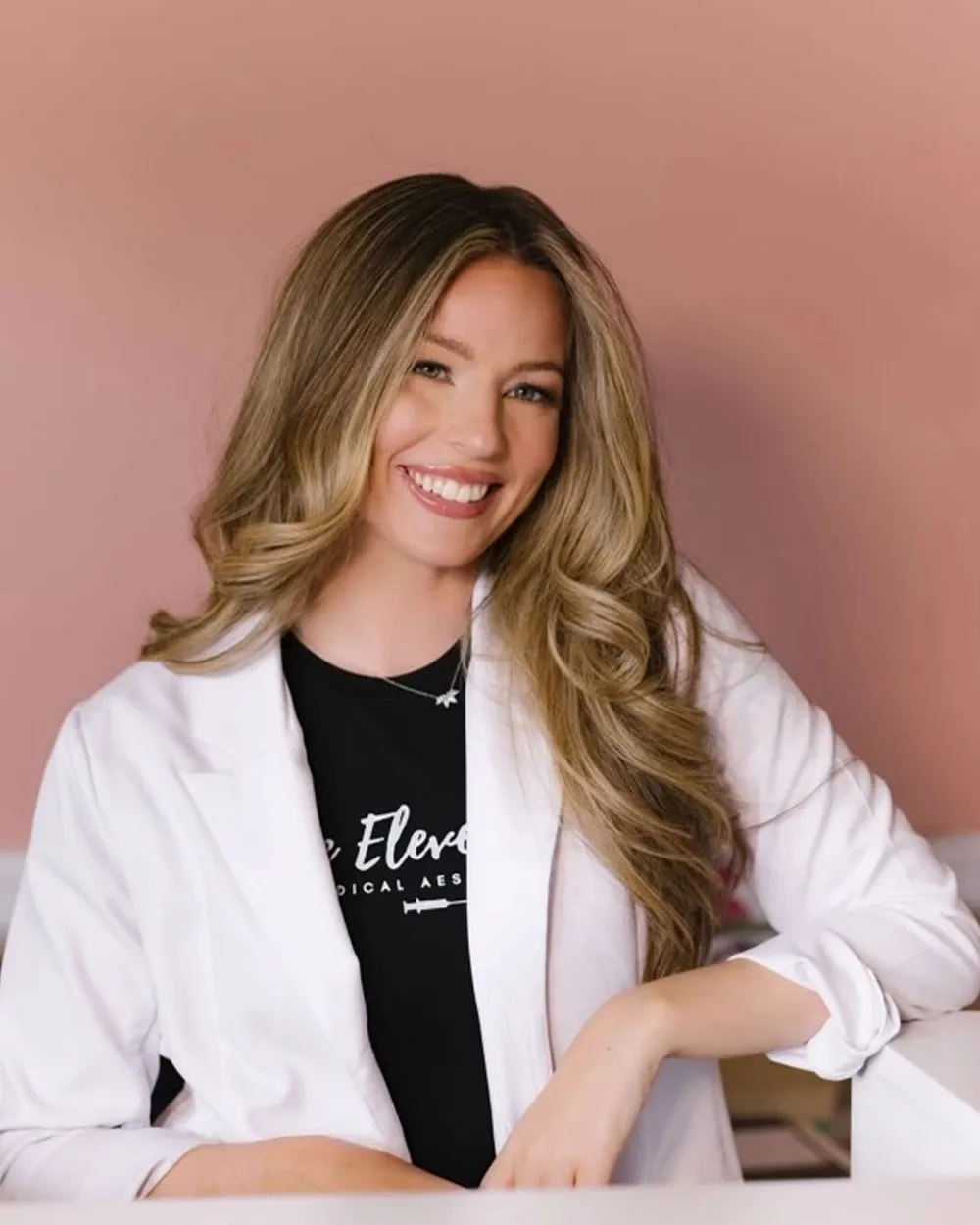 Staff posing in white at One Eleven RX in Auburn, MA.