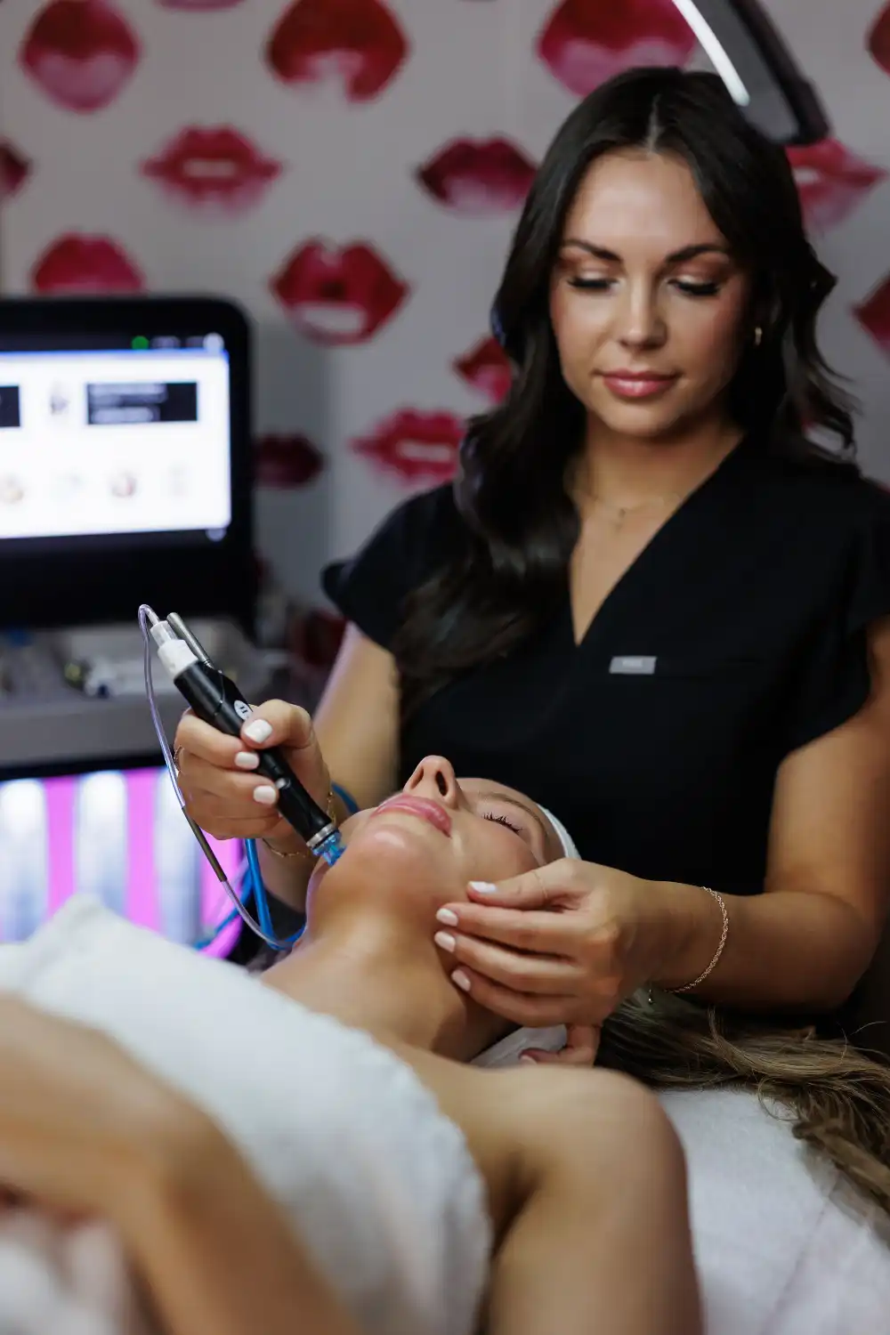 Licensed aesthetician performing HydraFacial treatment at One Eleven RX, Auburn, MA