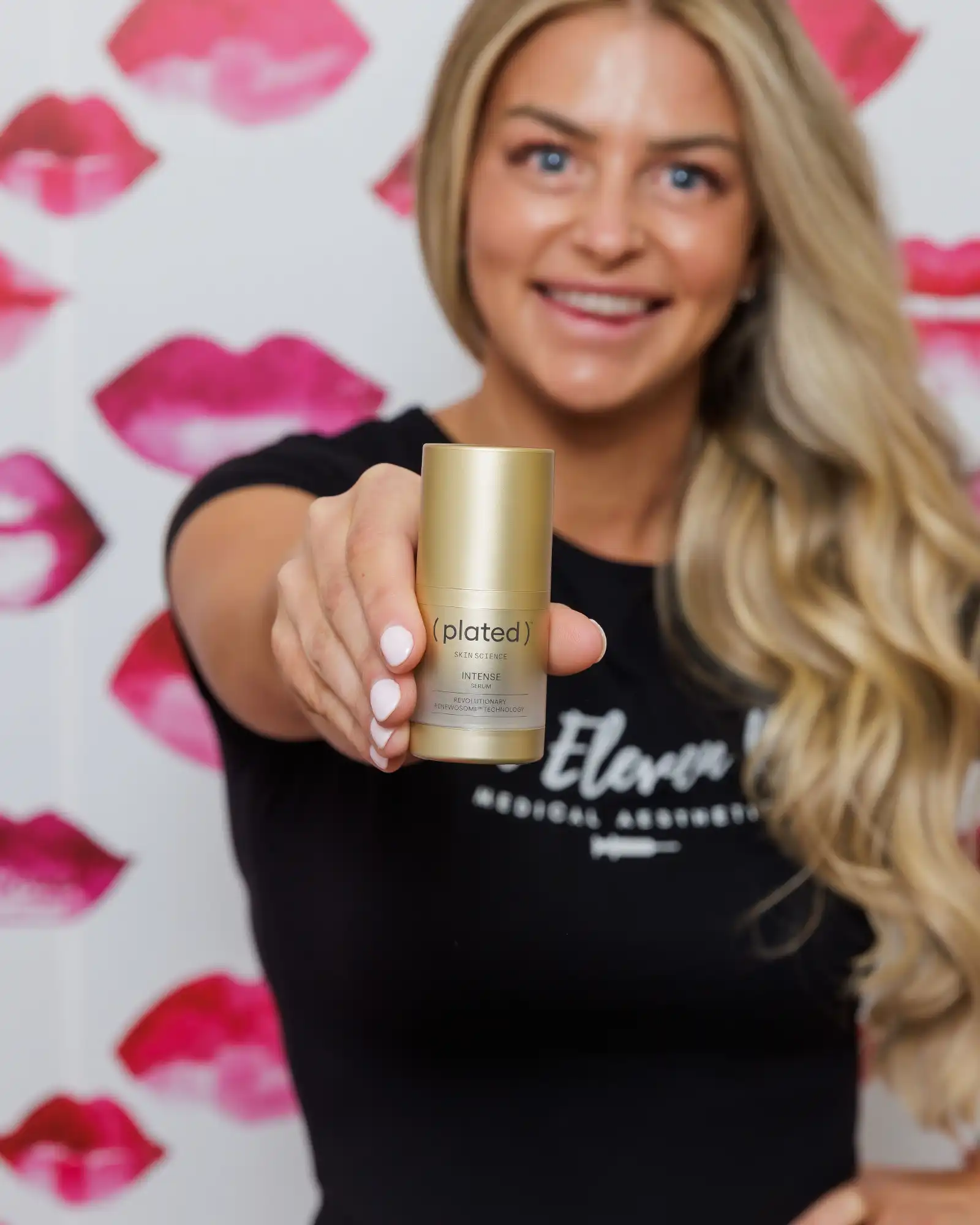 Woman holding Plated skincare product at One Eleven RX Medspa, Auburn, MA, Medical aesthetics provider assessing facial symmetry and skin condition with clinical precision