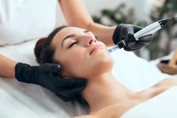 Client reviewing skincare treatment plan before aesthetic appointment in a calm consultation room