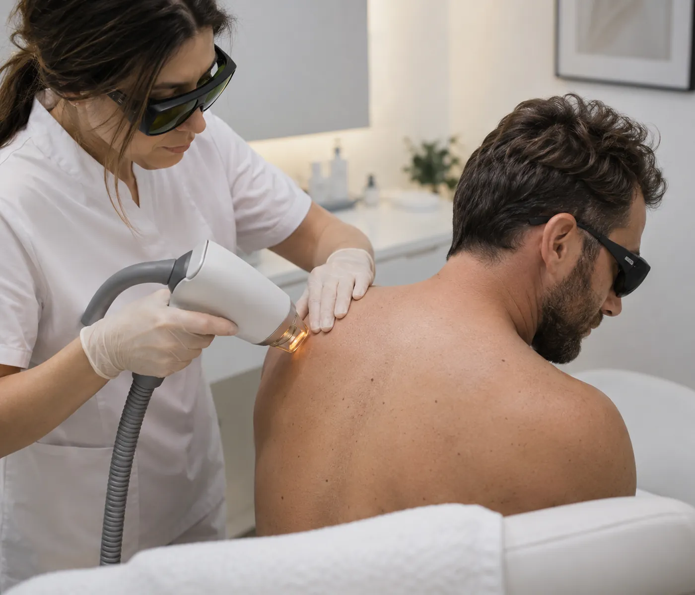 Laser Skin Removal specialist in Milford - MA reviewing settings before treating a small target area